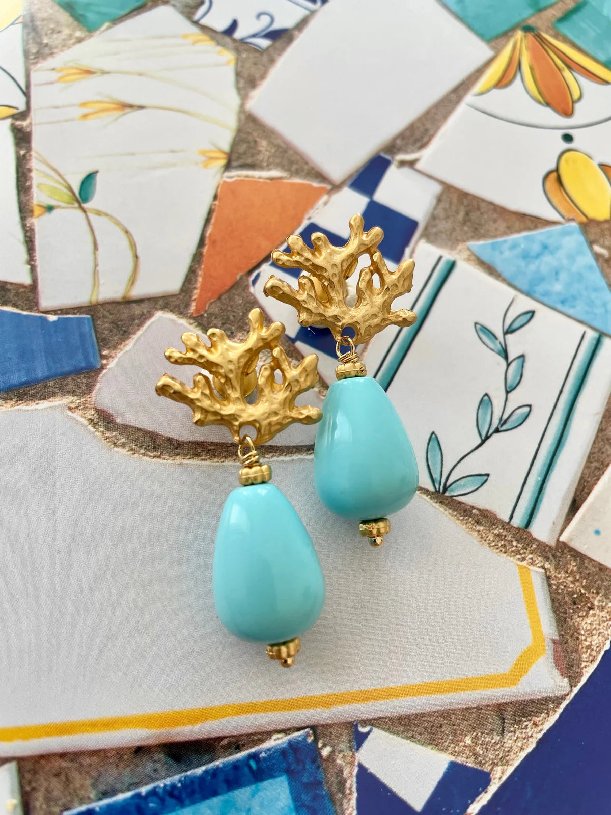 Handcrafted ocean-inspired Ravello Earrings featuring turquoise drops and gold coral posts, perfect for summer outfits.